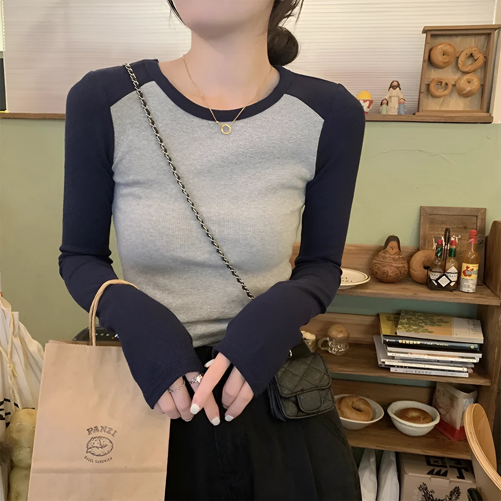 Women's dark blue oversized viscose top with long princess sleeves and embroidery detail.
