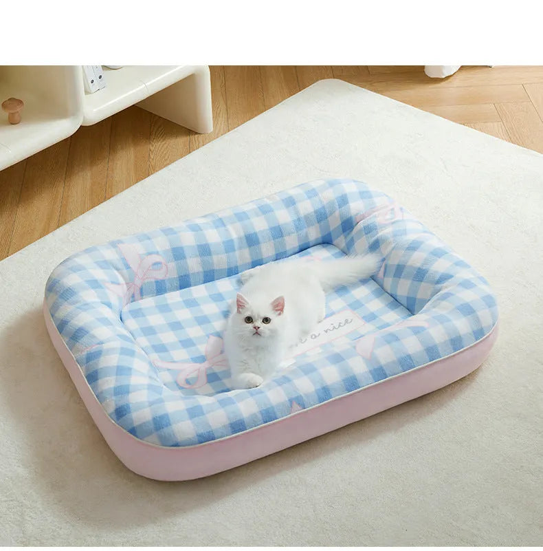 Blue small dog bed cushion with PP cotton fill, size M, on a sofa