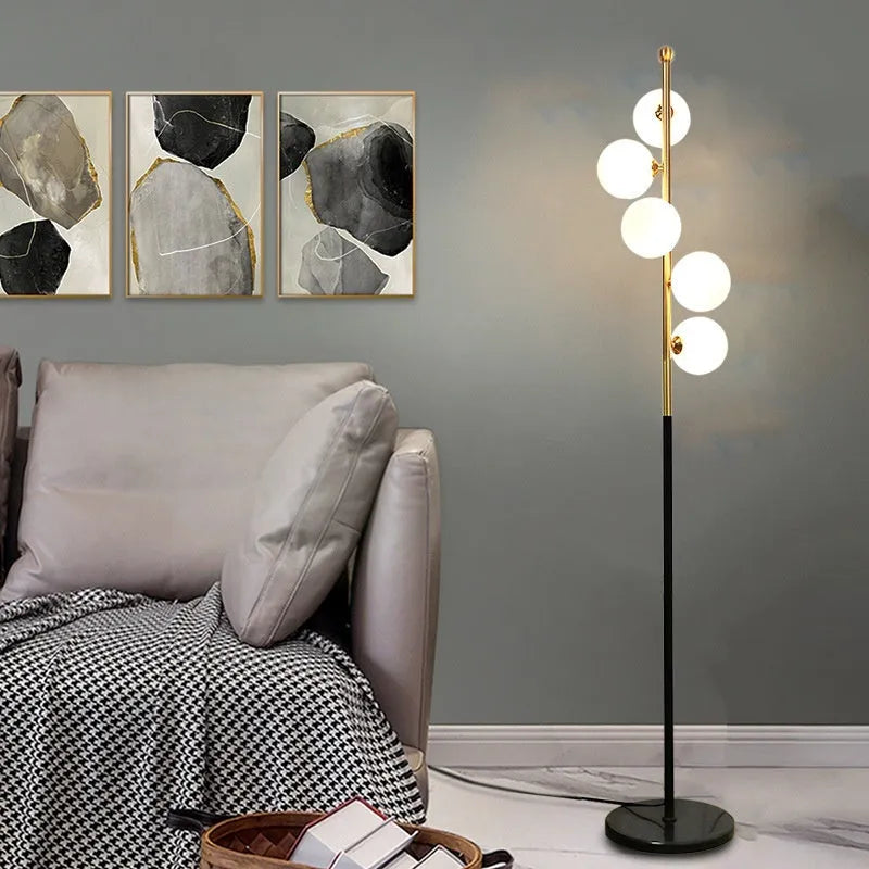 Simple iron floor lamp with 8W LED tricolour bulb in black ribbon gold finish