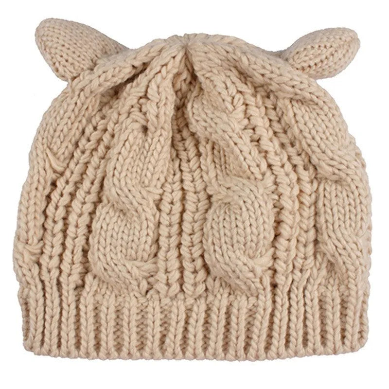 Hand knitted winter beanie with 3D cat ears in soft wool, shown in multiple colours.