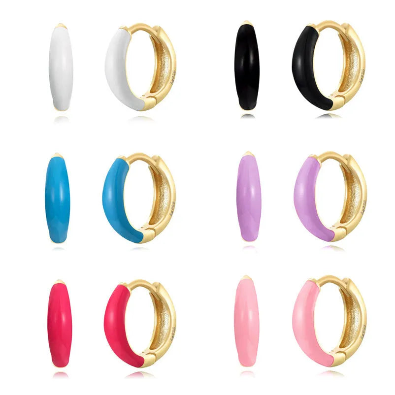 A pair of U-shaped geometric earrings with a glossy oval centre, in a choice of seven epoxy resin colours.
