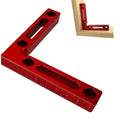 Solid aluminium right angle woodworking positioning block with measurement scale, shown with clamps and jigsaw.