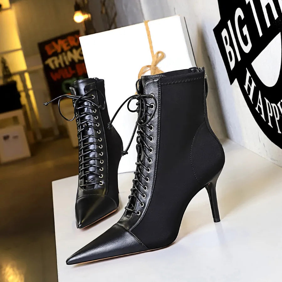 Black women's stiletto heel boots with pointed toe, back zipper, and 6-8CM heel