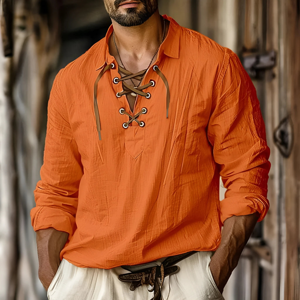 Men's loose blue linen-blend shirt with lapels and long sleeves on a hanger.