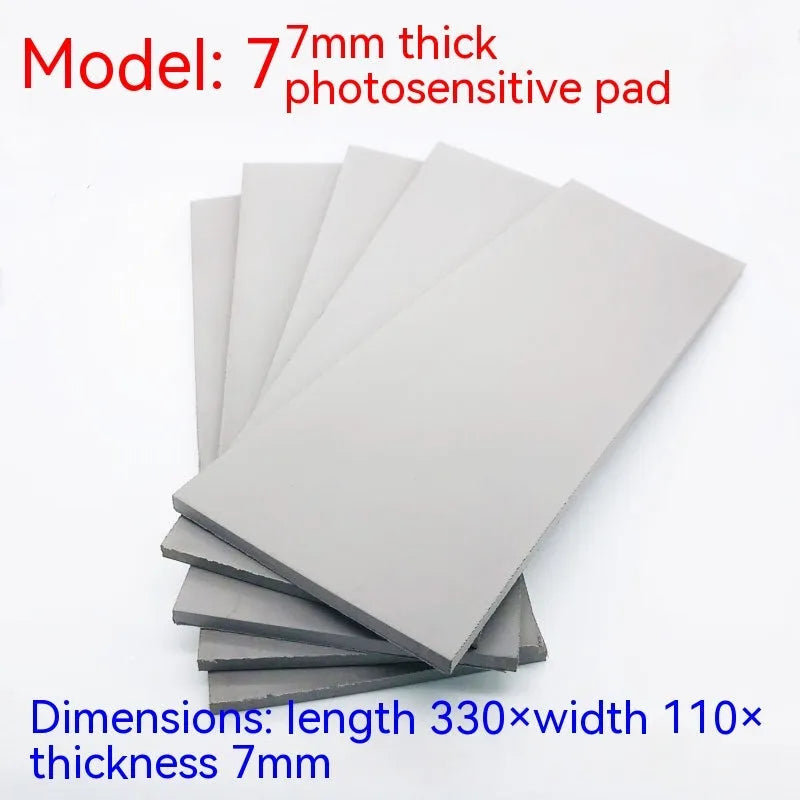 Black and grey plastic light-sensitive mat for seal making, showing 2mm, 4mm, and 7mm thickness options.