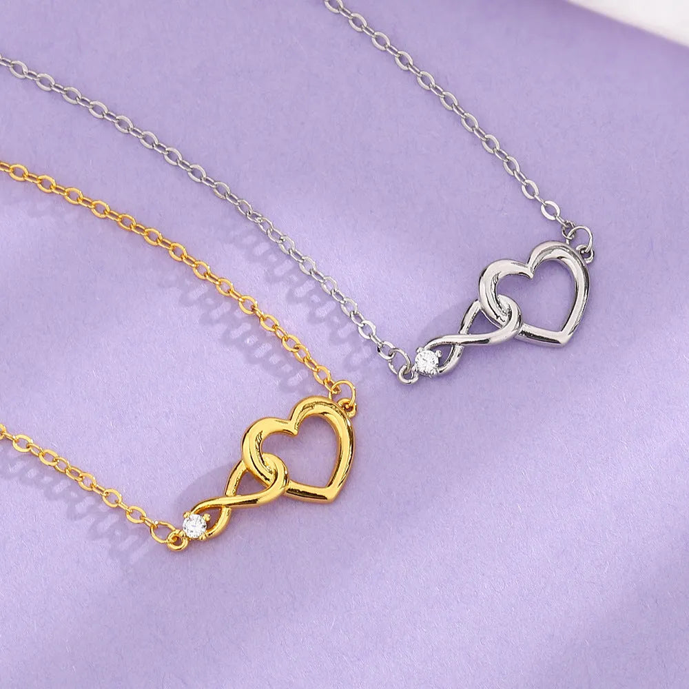 Heart-shape copper bracelet with clear 3A zirconia stone on adjustable chain in platinum finish