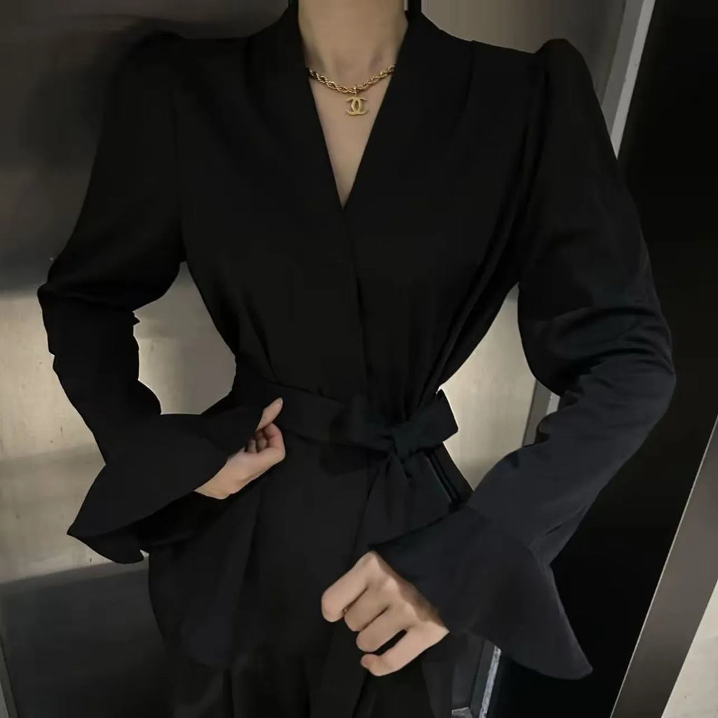 Women's black French-style shirt with an irregular collar and flared bell sleeves