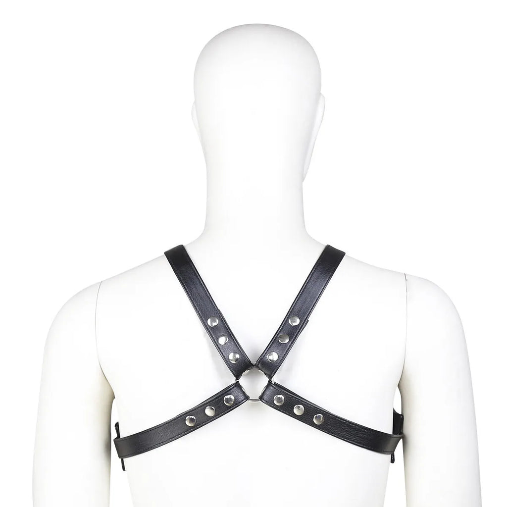 Black leather adjustable men's chest strap harness laid flat on a neutral background with adjustable fastener visible