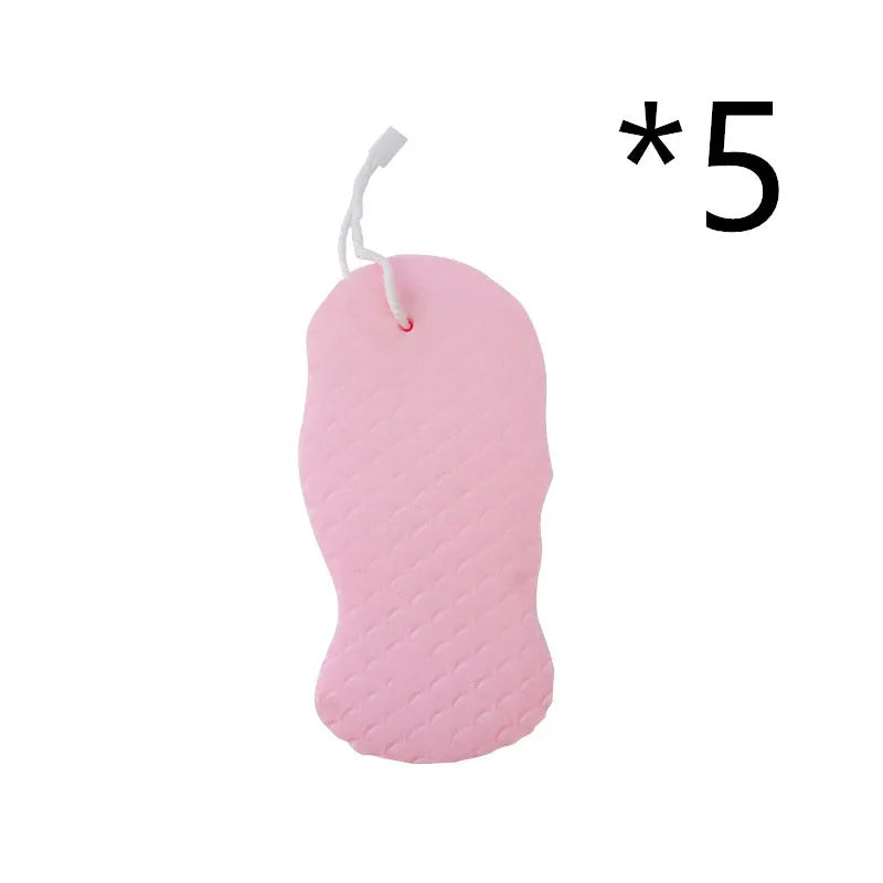 White 3D fish scale pattern bath sponge with hang loop on a bathroom background.