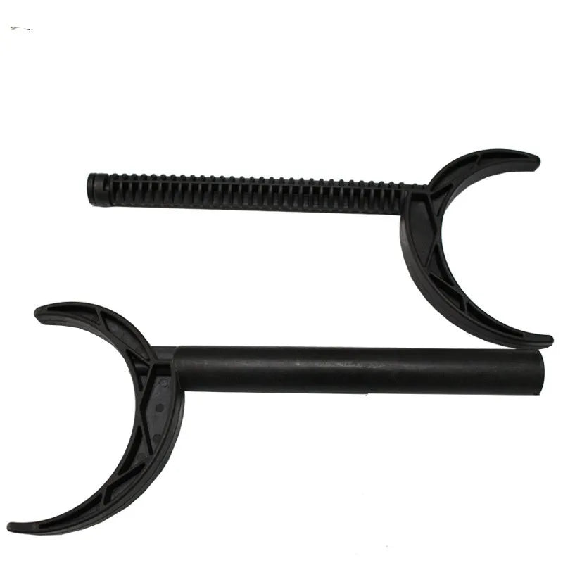 Portable black plastic wedge simulator for golf horn cutting drills on a flat surface