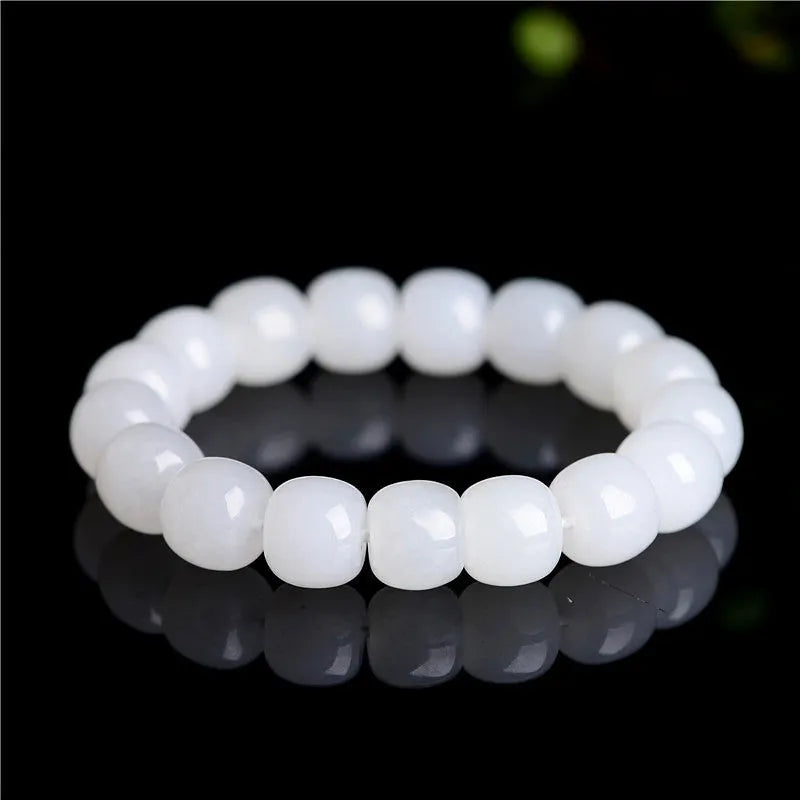 A white Hetian jade barrel bead bracelet showing three size options on a neutral background.