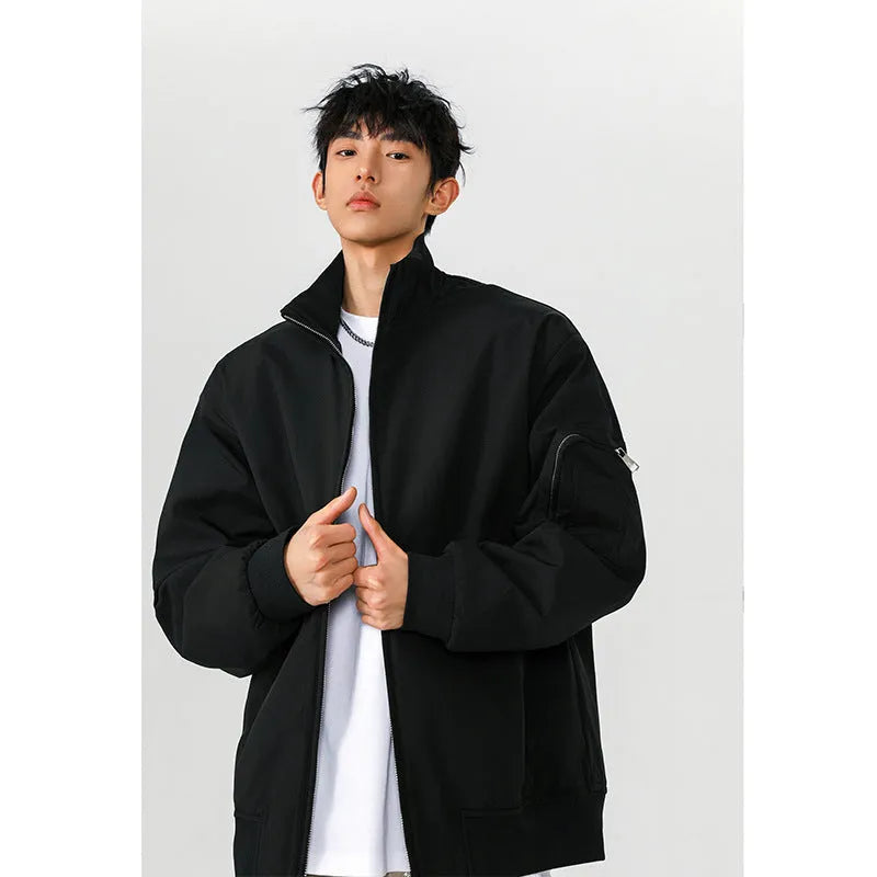 Men's large size multi-pocket short flight jacket in black, loose fit, polyester fiber fabric with visible pockets.