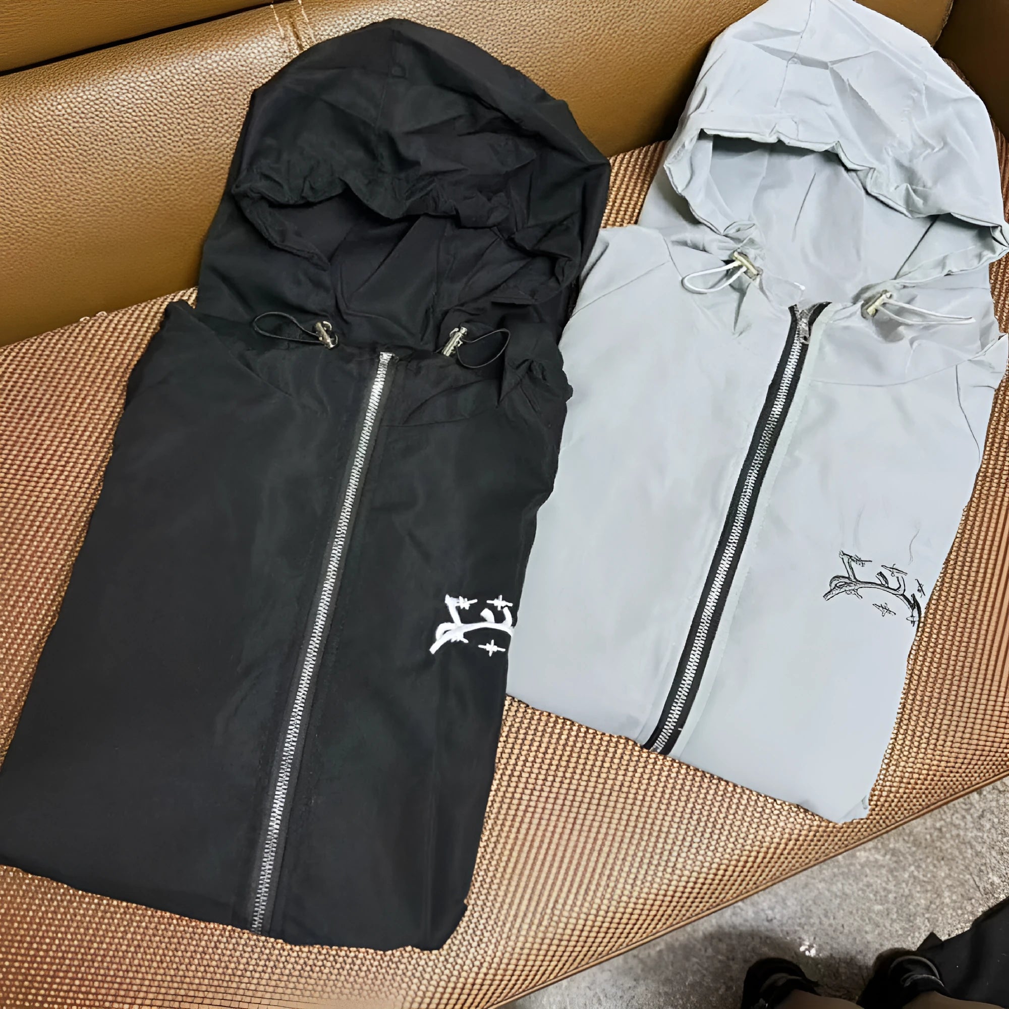Men's grey loose hooded British-style jacket with polyester fabric on mannequin