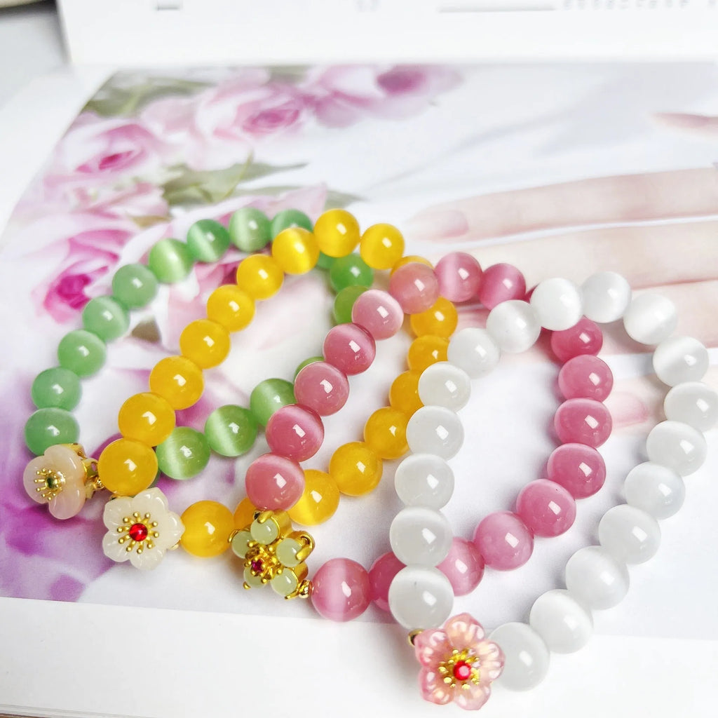 Handmade glass bracelet with flower beads in yellow, pink, white, green colours