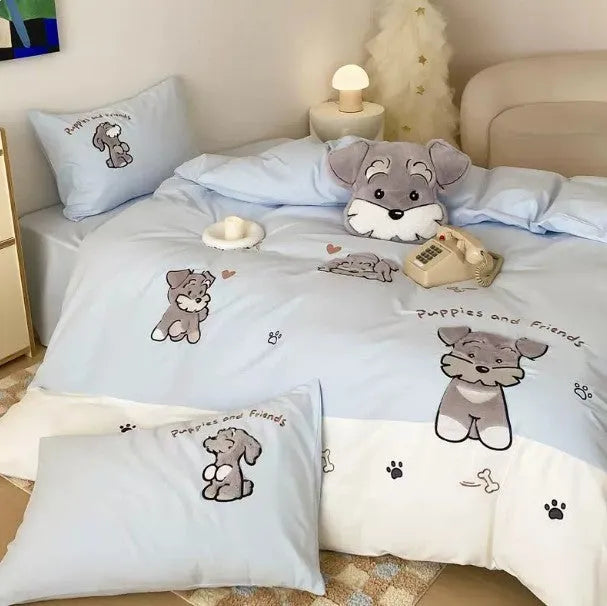 Cartoon Schnauzer design embroidered on a light blue cotton quilt cover and pillowcase.