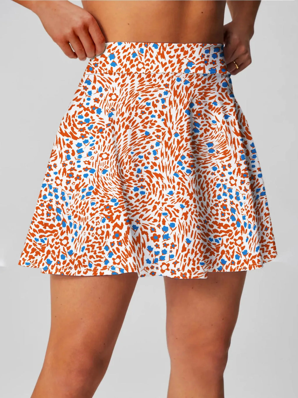 Women's high waist half-length sports skirt in blue, shown for golf or tennis.