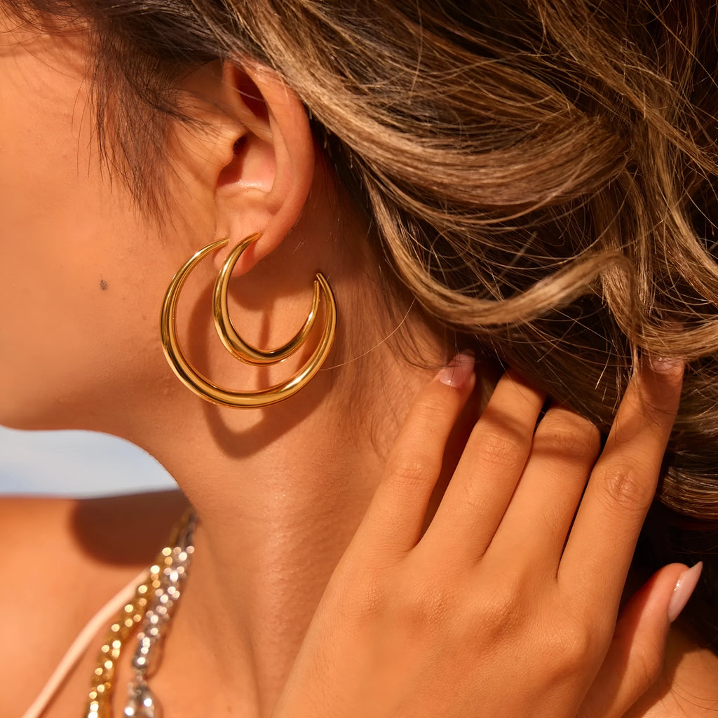 Titanium steel hoop earrings with 18K gold plating in geometric round design