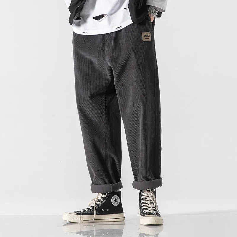 Men's loose straight corduroy sports trousers in Army Green colour showing mid-waist and full length design