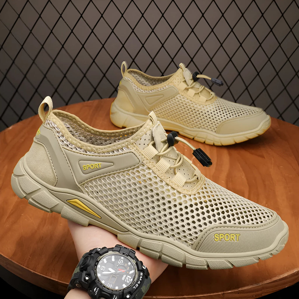 Pair of breathable outdoor sandals with leather mesh upper, flat heel, and round toe in gray, black, and khaki colours