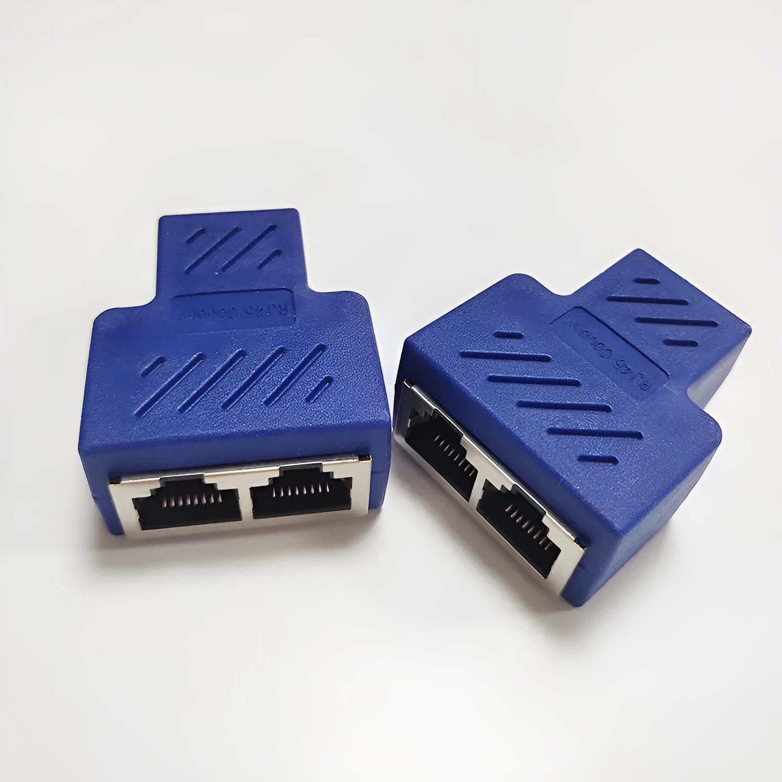 Two white RJ45 network tee splitters, one male to two female ports.