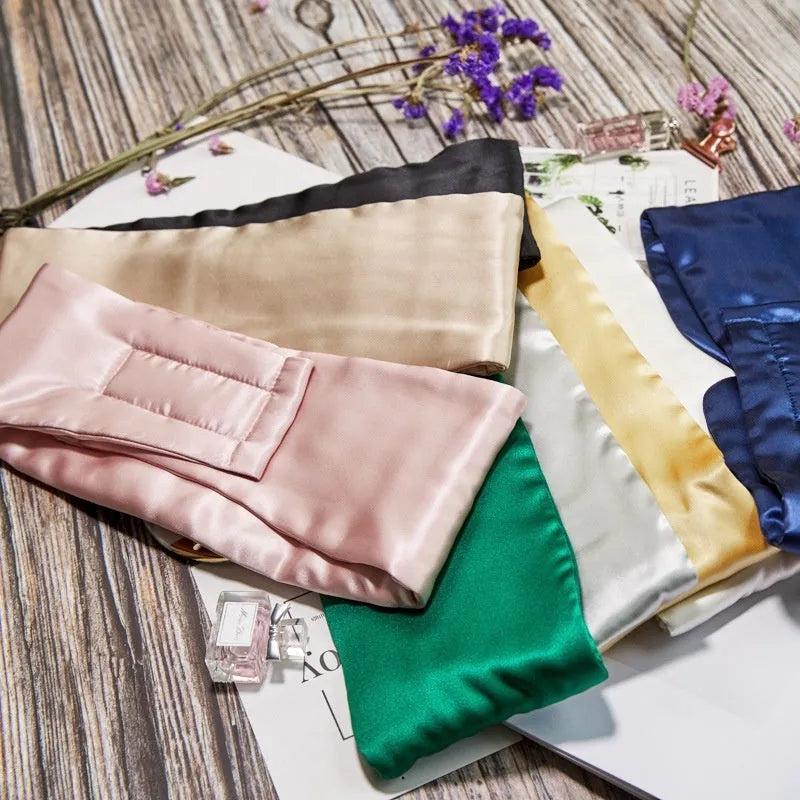 Silk sleep eye mask in multiple colours including black, champagne gold, and navy blue.
