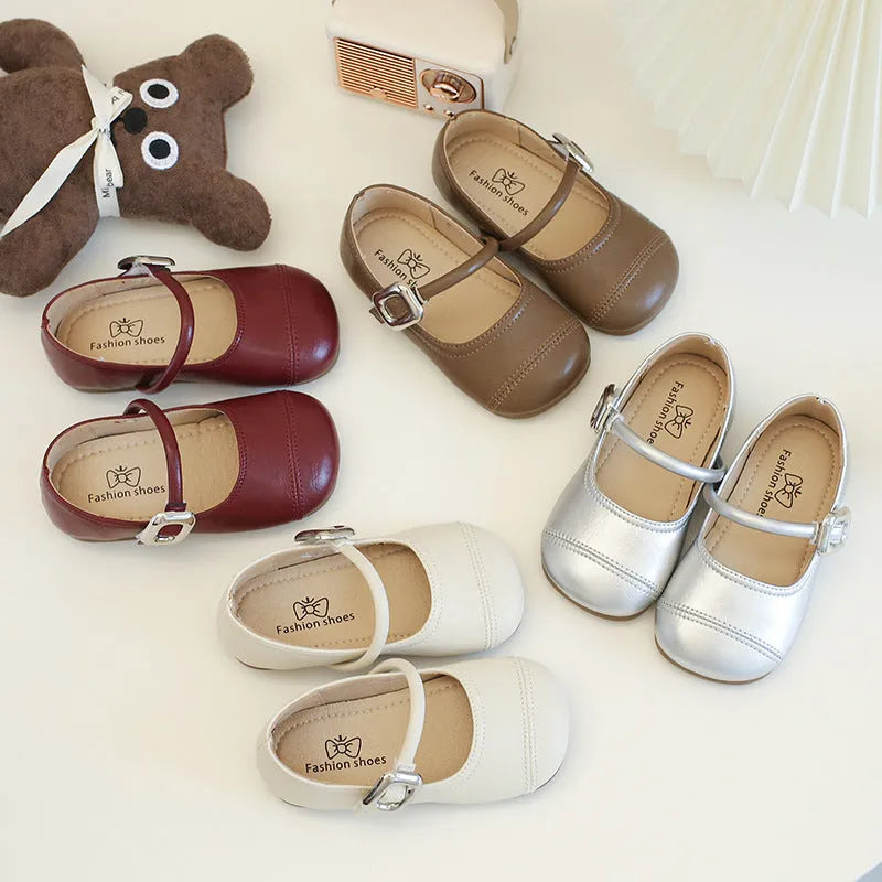 Girls PU leather Mary Jane shoes in solid beige colour with single strap, size 35, side view