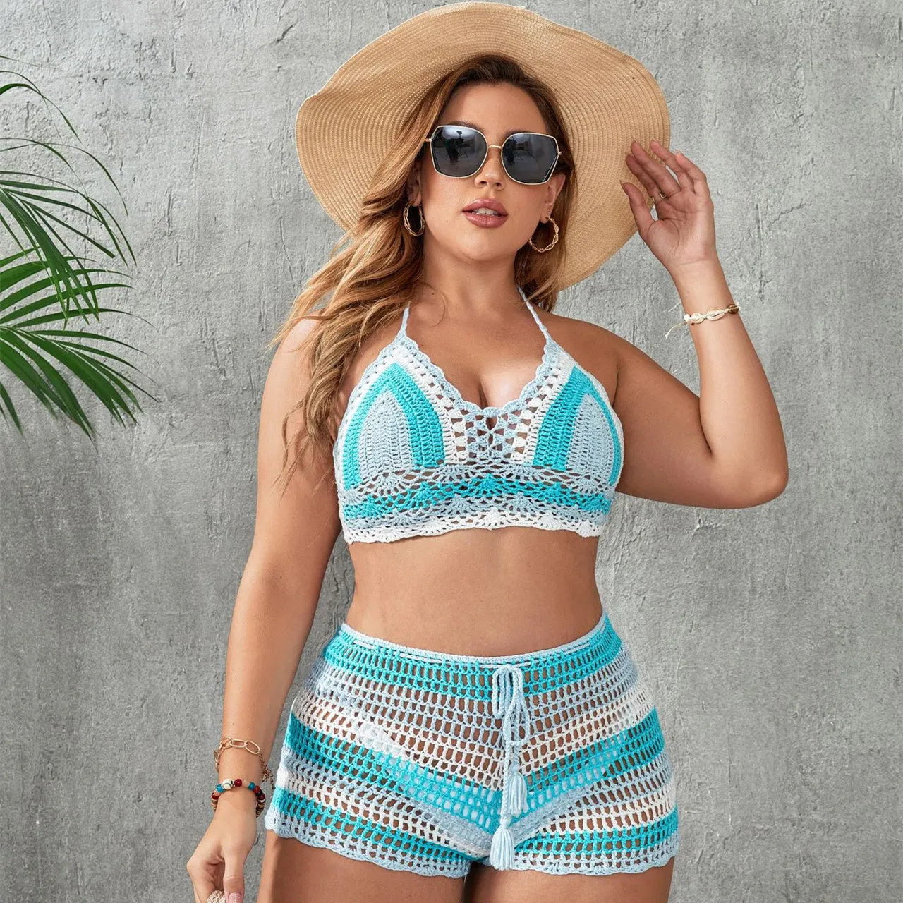 Women's blue briefs style swimsuit with hollow out strap design and split side detail