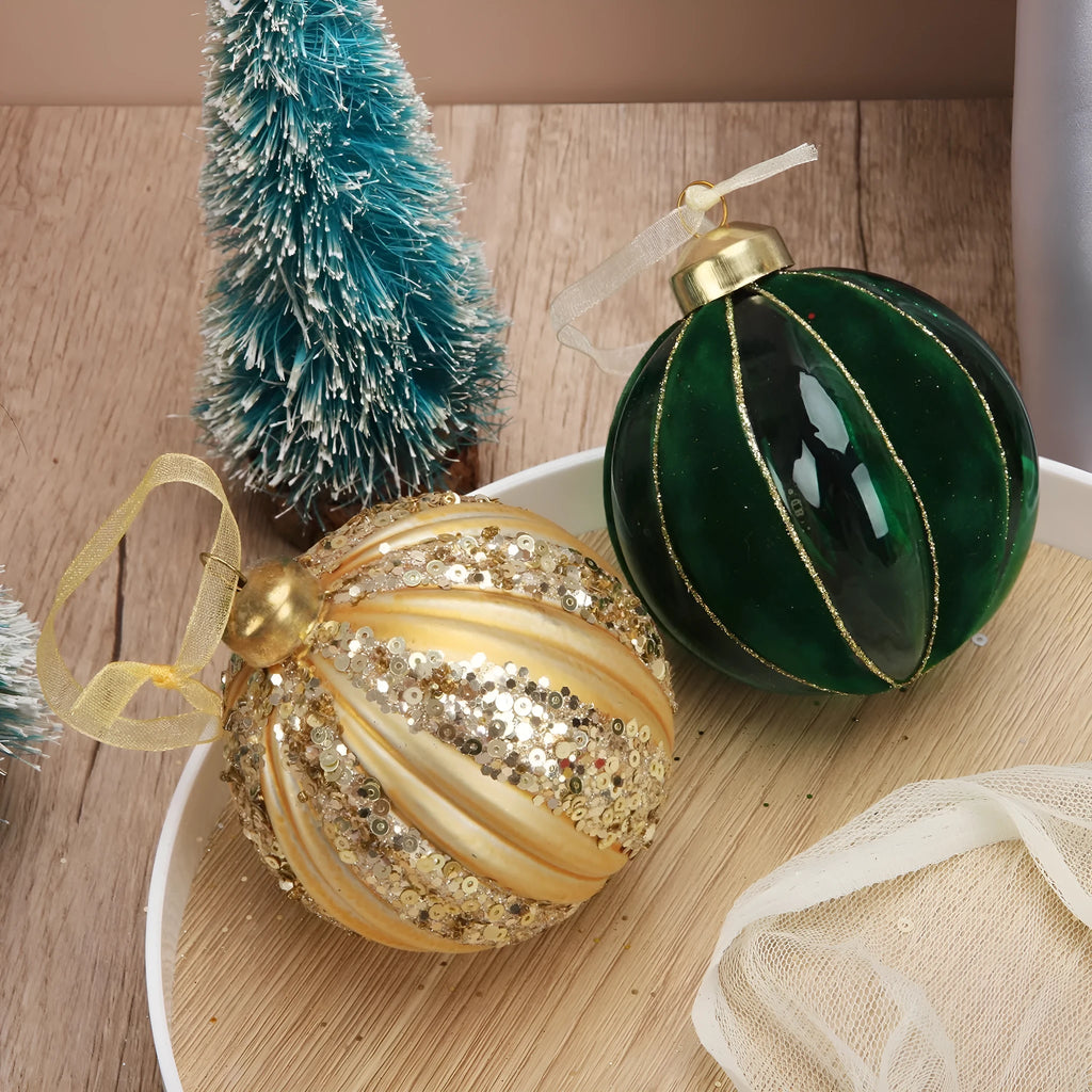 Green and yellow flocked stripes on a 80mm blown glass Christmas ball decoration with mosaic surface