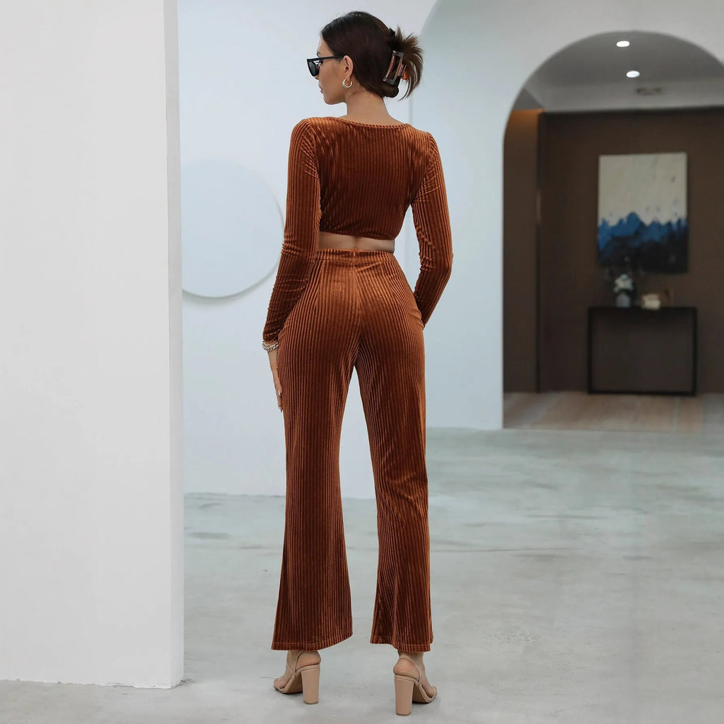 Caramel-coloured women's long sleeve knit sweater and matching trousers laid flat, a two-piece loungewear set.
