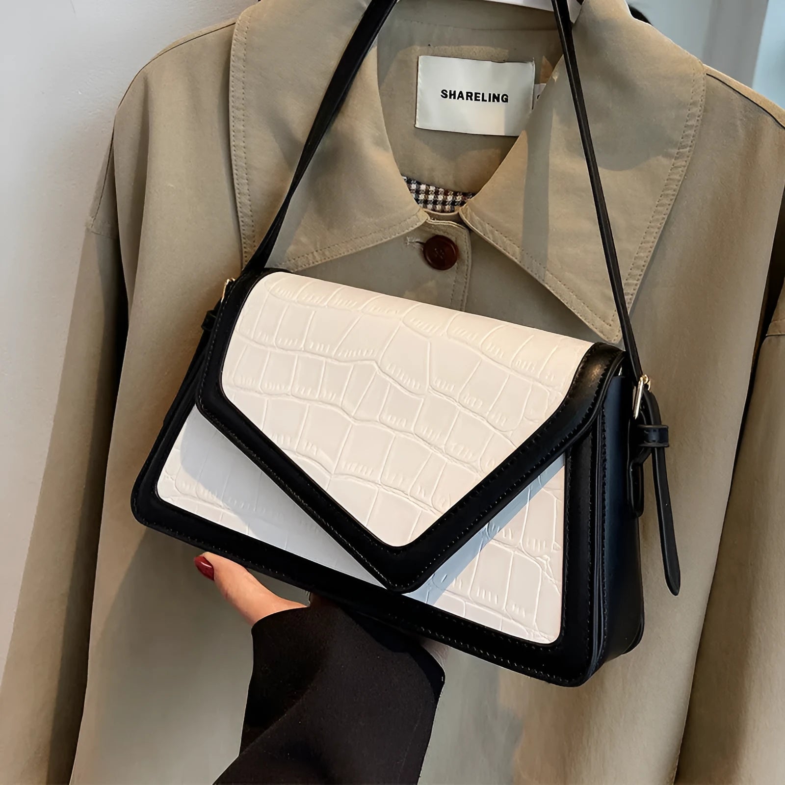 Women's square shoulder bag in PU leather with urban simplicity style showing horizontal shape