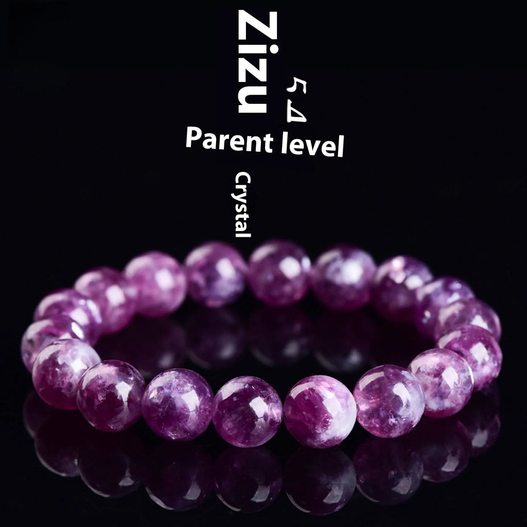 Geometric purple and pink polished crystal bracelet on a wrist, showing single strand of beads.