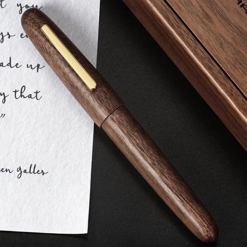 Wooden fountain pen with rotating cap showing grain detail and nib options