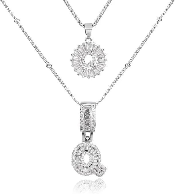 26 English letters copper-plated gold diamond initial pendant necklace with adjustable chain on display