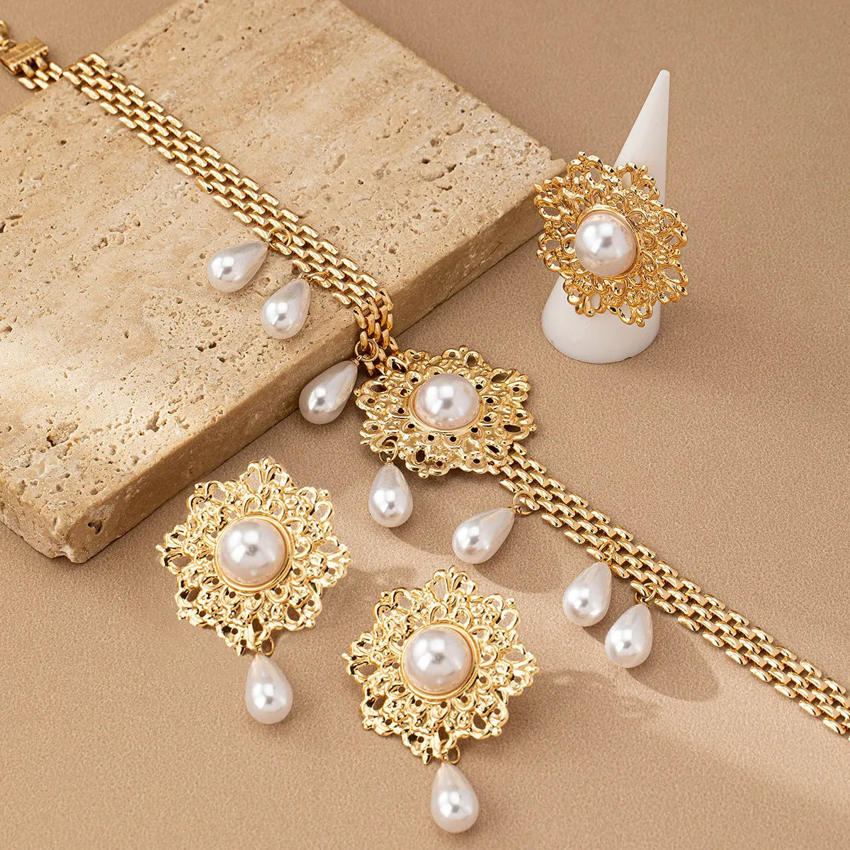 French retro hollow flower pearl tassel jewellery set in white, including necklace, earrings, and ring, alloy material