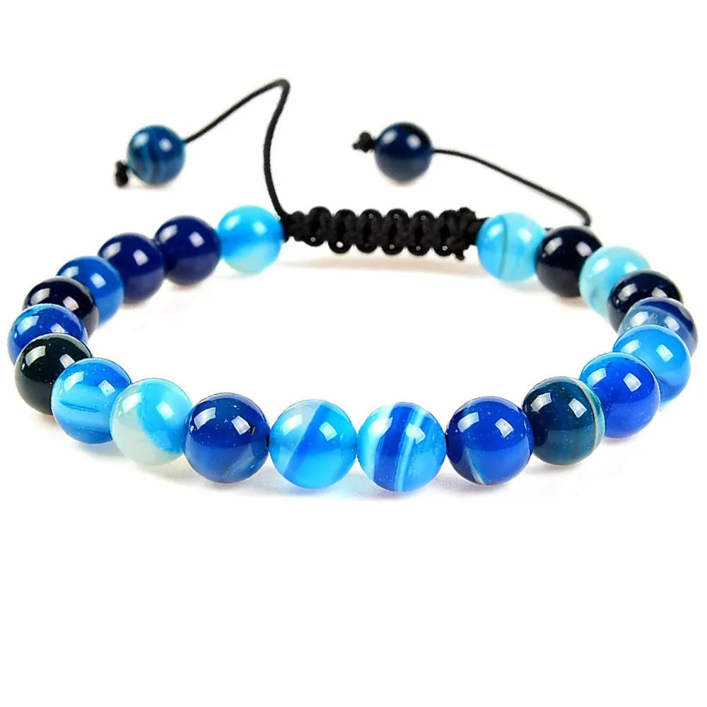 Women's flat knot braided healing bracelet with hand-woven aquamarine beads and geometric patterns
