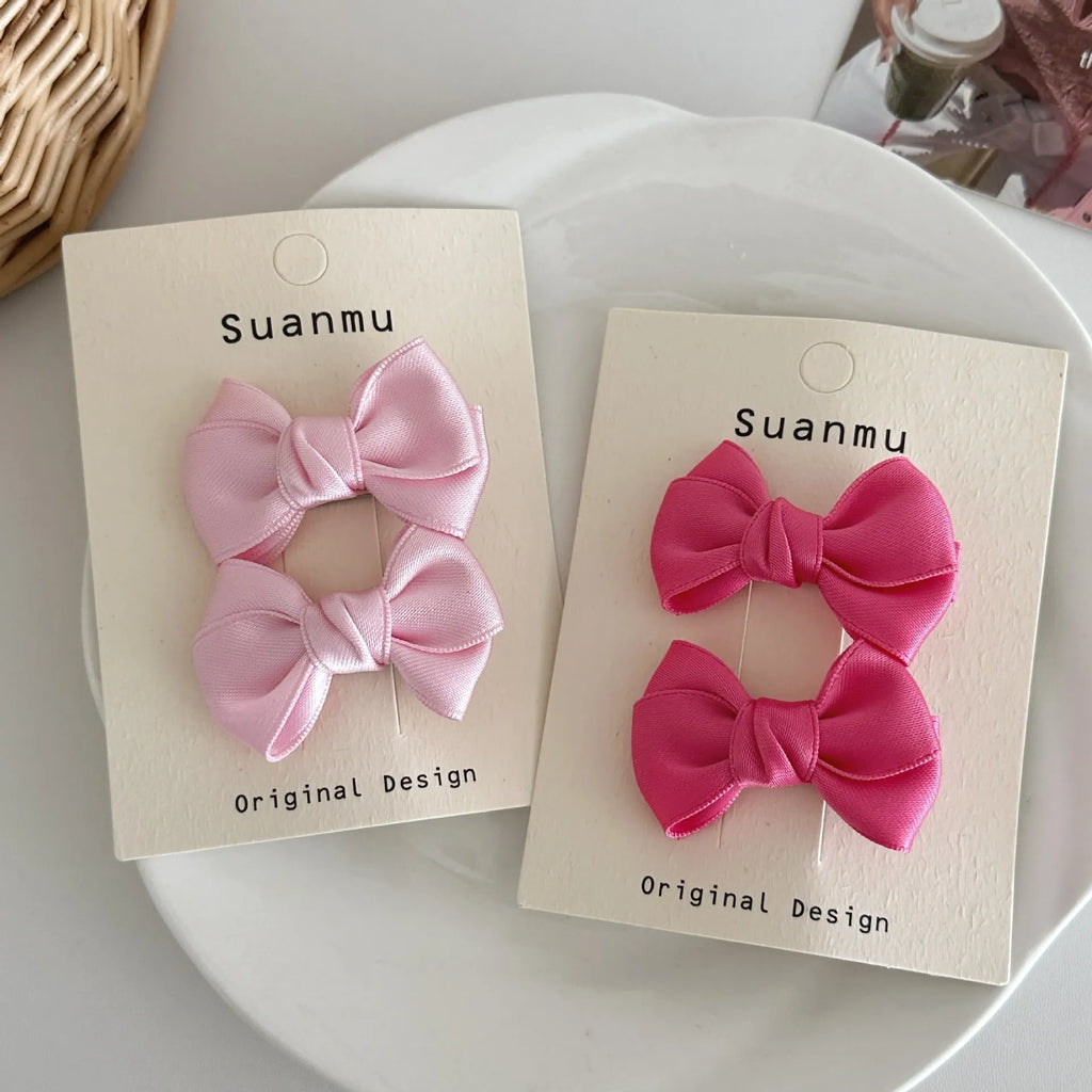 Fabric bowknot children's hair clip in cream colour with 6cm bow size on side clip