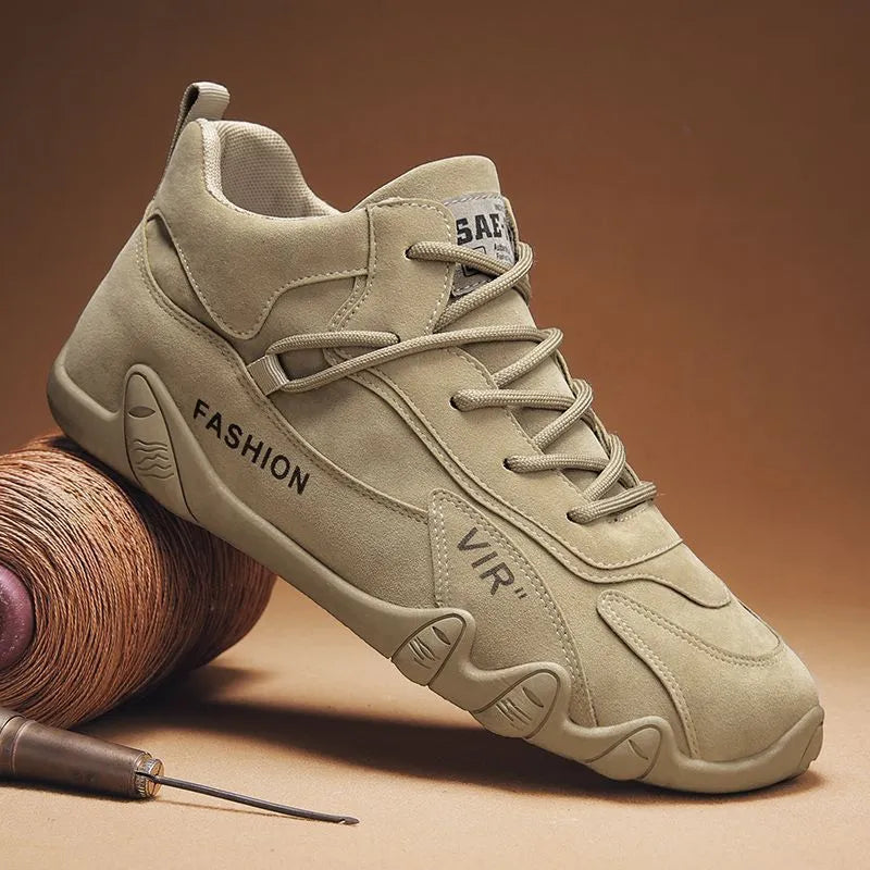 Men's grey low-cut casual shoe with elastic band and synthetic leather upper on a non-slip sole.