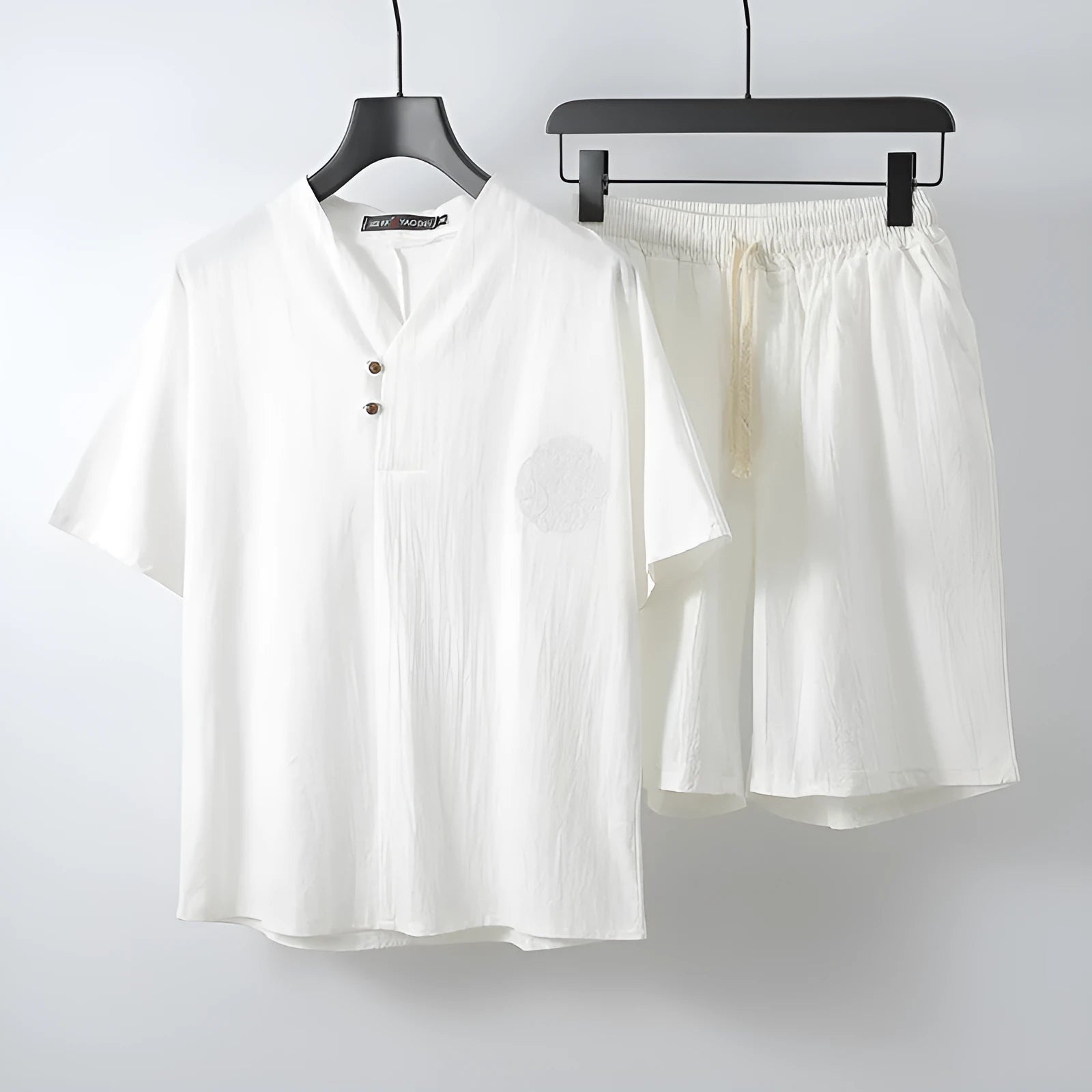 Loose-fitting cotton two-piece set for men with short sleeves and shorts in apricot colour.