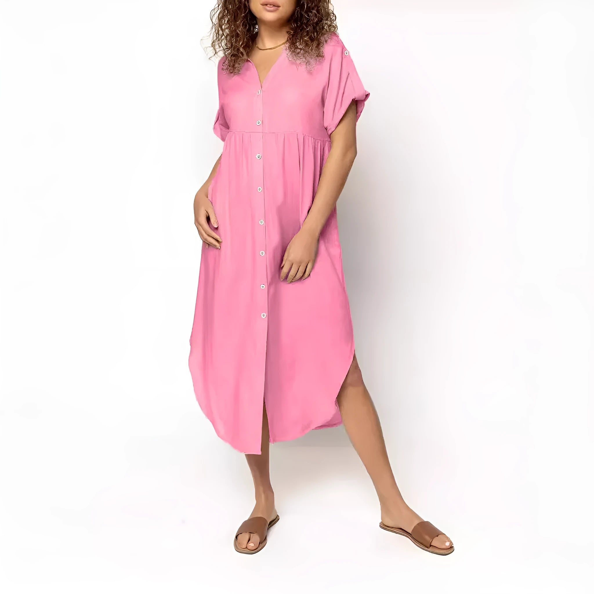 A loose-fitting mid-length casual dress with a button-down front, shown in a solid colour.