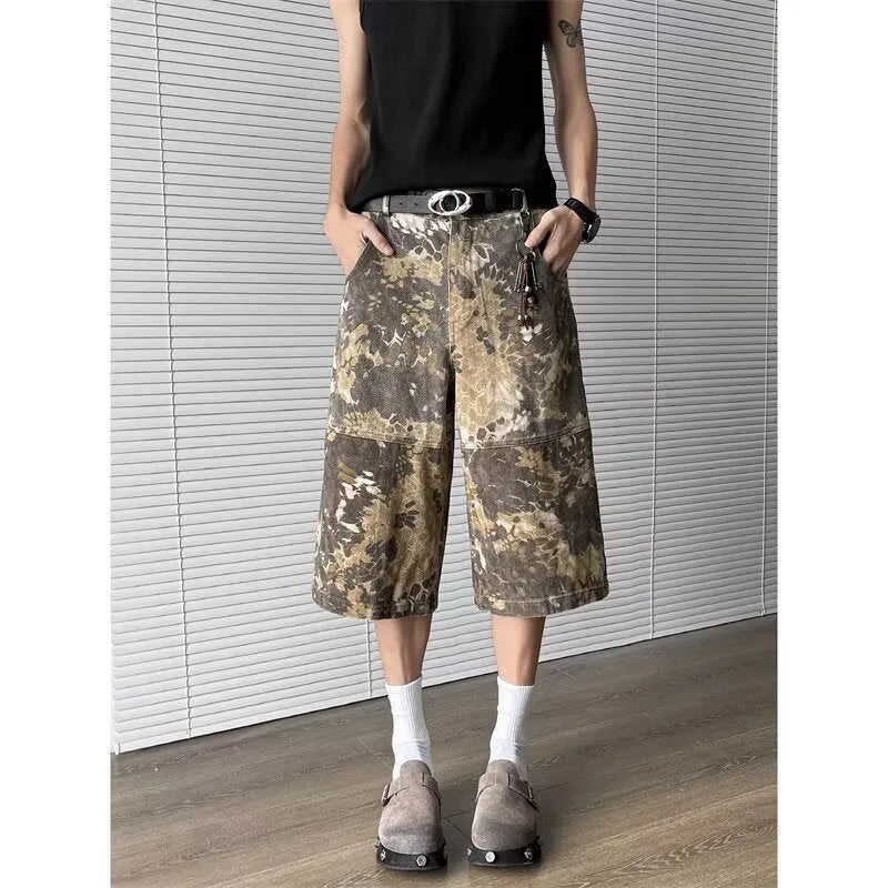 Yellow cotton jeans with a detailed snake pattern and camouflage print, featuring a cropped leg length.