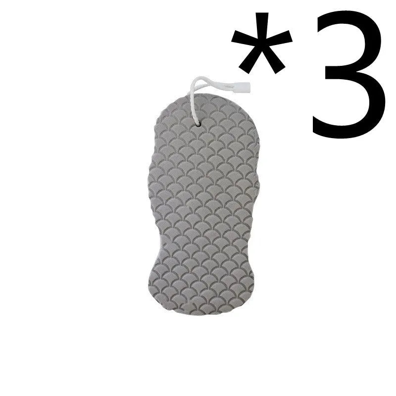 White 3D fish scale pattern bath sponge with hang loop on a bathroom background.