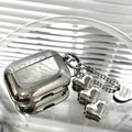 Electroplated solid colour TPU headphone case with heart pendant charms and chain for Apple earbuds.
