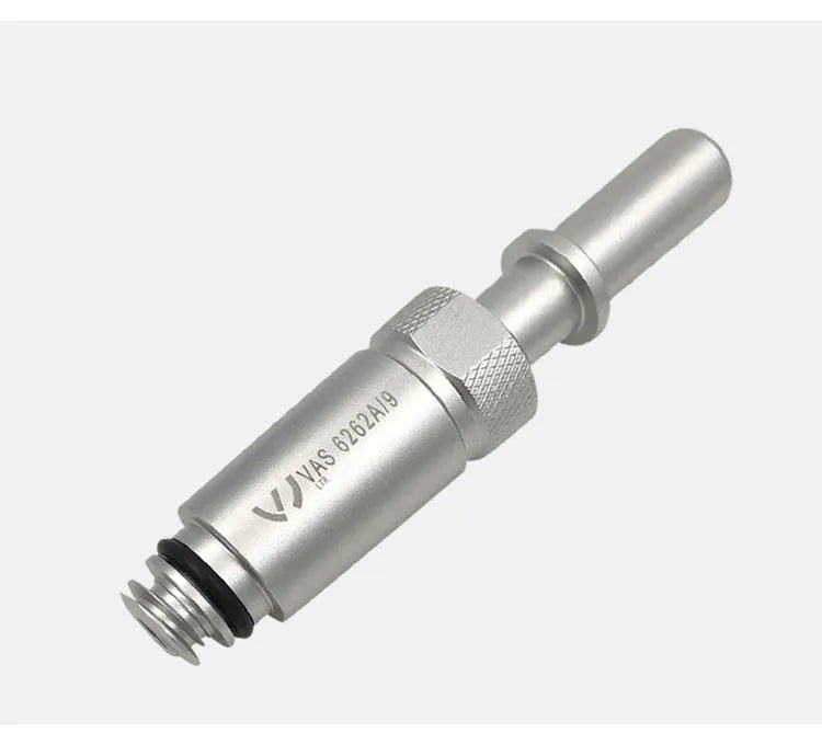 Silver metal VAS6262-9 transmission refueling joint tool on a workshop bench.