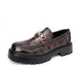 Men's black crocodile pattern leather loafers with a platform sole and flat heel.