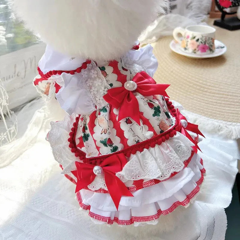 Small white dog wearing a pink rabbit skirt princess dress, showing flared shape and fit.