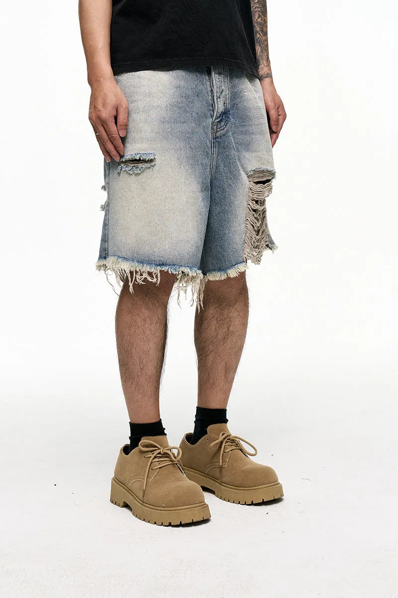 Light blue retro washed men's baggy denim shorts on a mid-rise mannequin, showing wide-leg cut.
