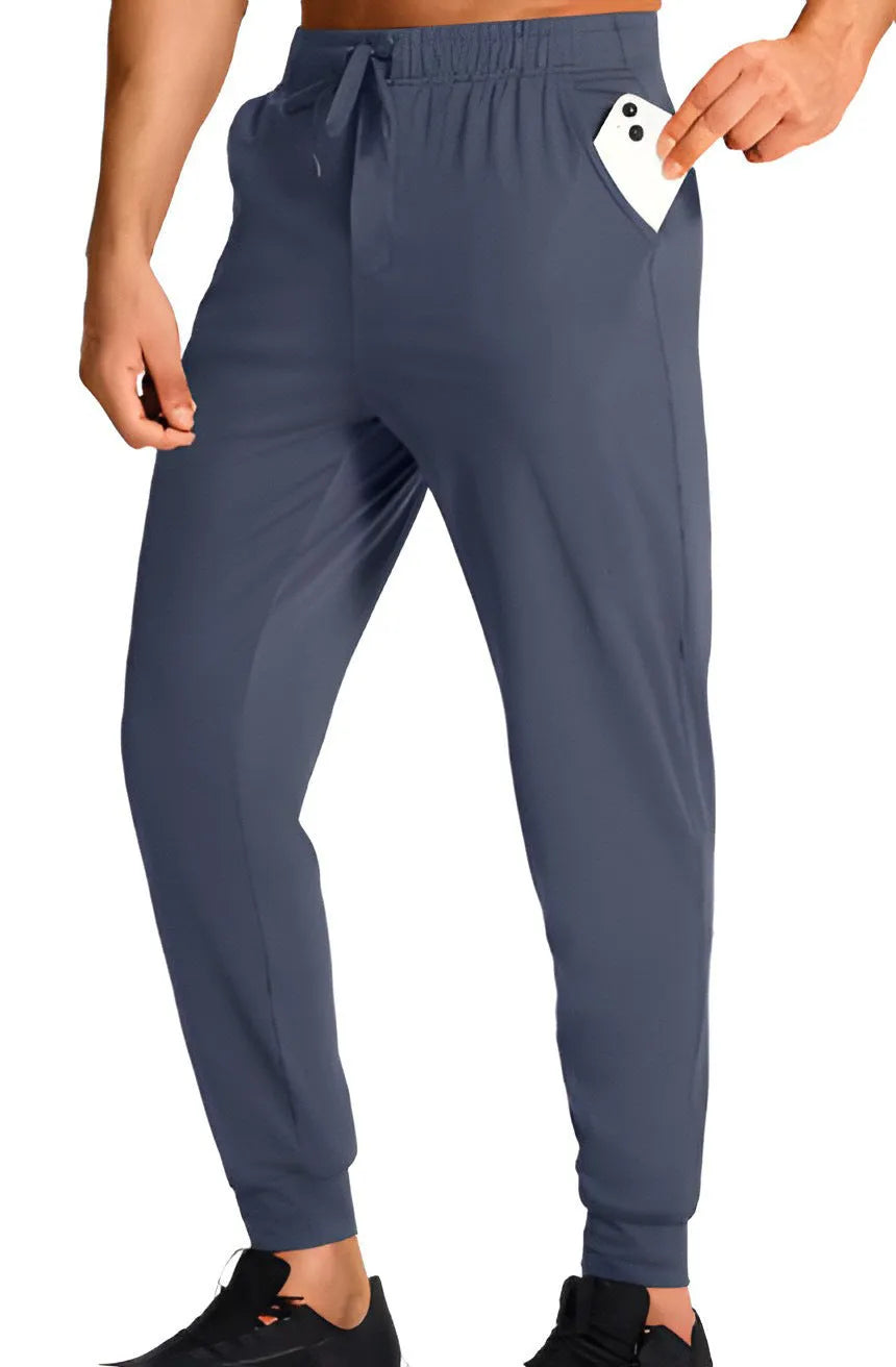 Men's solid-colour loose casual trousers in polyester fabric, shown in one of twelve available colour codes.