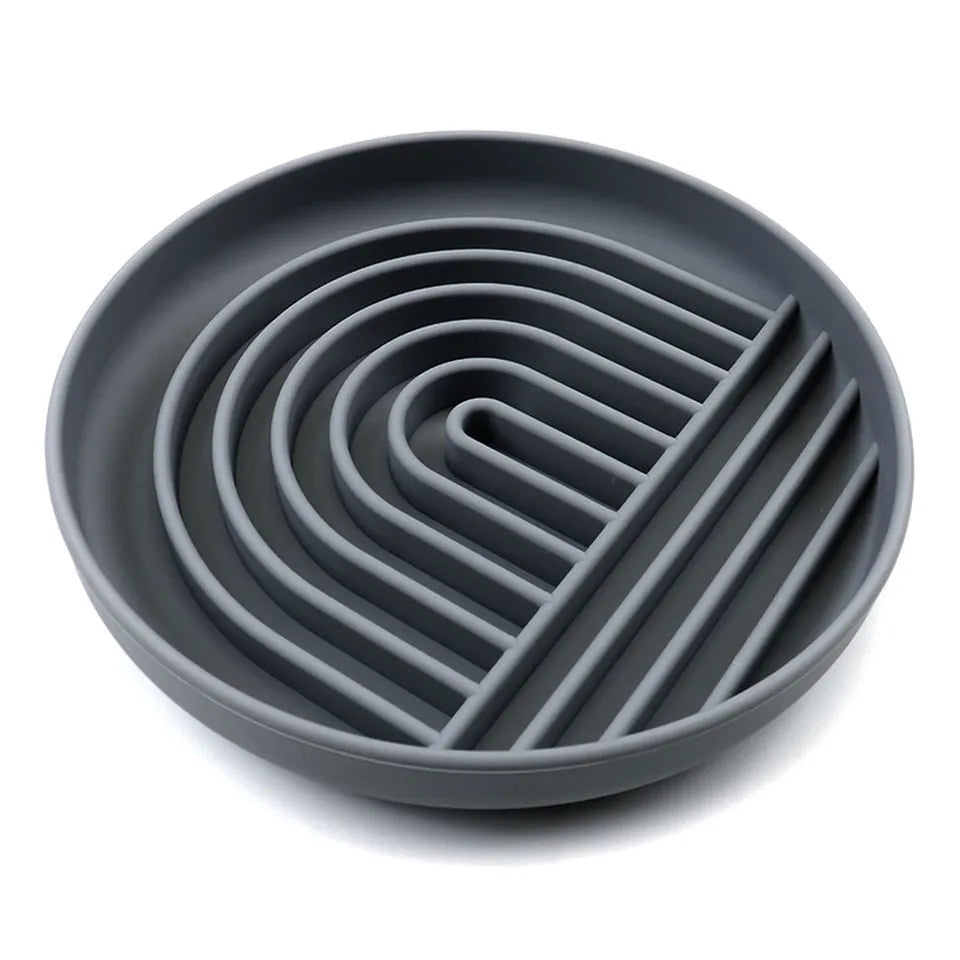Silicone slow feeder dog bowl with textured ridges and lick mat design.