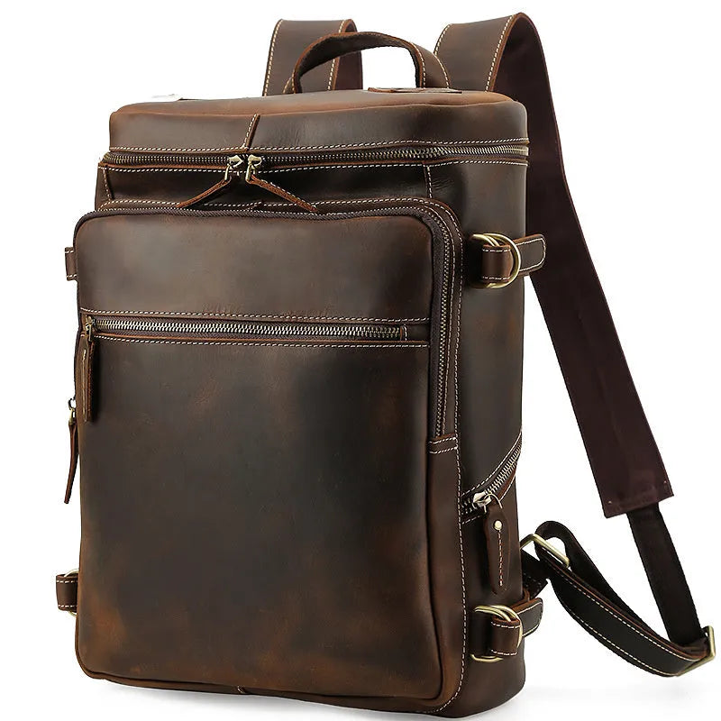 Large brown leather backpack with zipper closure, under 20L capacity