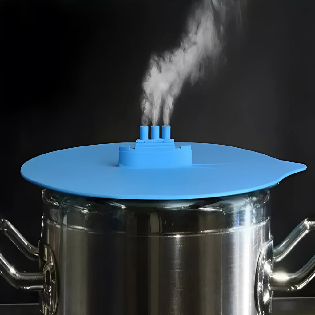 Silicone steamer lid anti-skid and shatter-proof in green on a pot